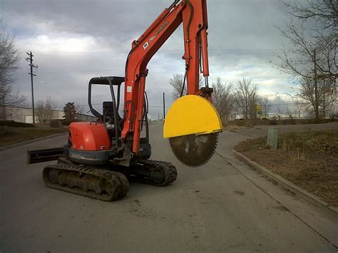 mini excavator rock cutter|concrete rock saw for excavators.